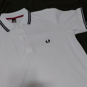 Capital Underground. White Polo With Black Trim. Medium.